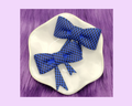 D. Blue and Black Bow Straw Topper