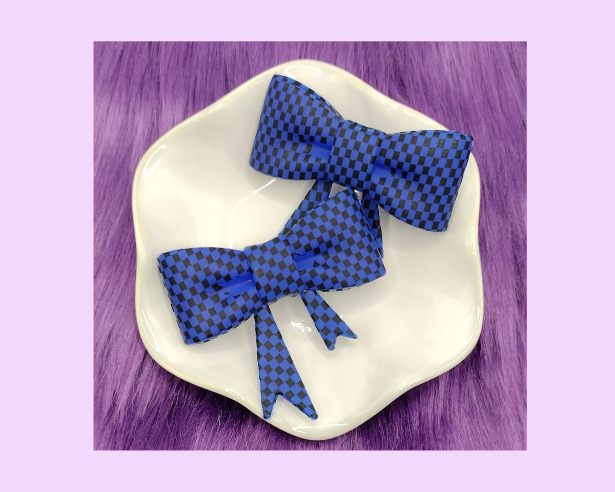 D. Blue and Black Bow Straw Topper