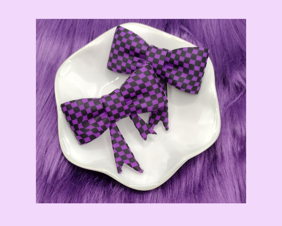 D. Purple and Black Checkered Bow Straw Topper